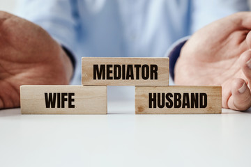 An attempt to mediate during a divorce and the last resort, that is the Court. Arranged blocks with the words Husband, Wife, Mediator and the Court. The order of the proceedings in family conflict. - obrazy, fototapety, plakaty