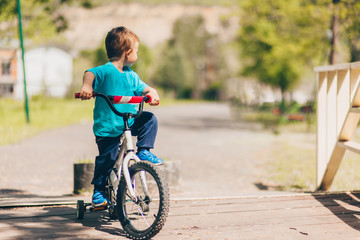 Happy child ride a bike