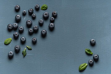 Blueberries background. Blueberry border design. Ripe and juicy fresh picked bilberries close up. Copyspace for your text