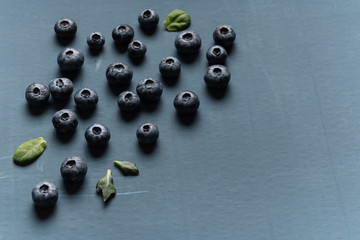 Blueberries background. Blueberry border design. Ripe and juicy fresh picked bilberries close up. Copyspace for your text