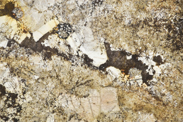 Closeup brown granite stone with natural pattern texture background.