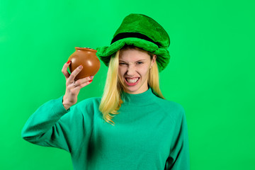 Patricks Day. Girl in green hat holds pot with gold. Saint Patrick's Day girl. Leprechaun. Irish...