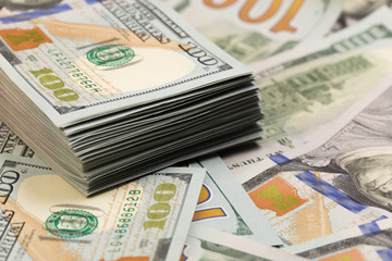 Stack of one hundred dollar bills close-up.