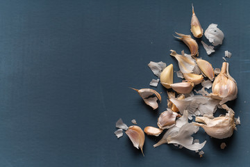 Garlic cloves on a vintage wooden background.