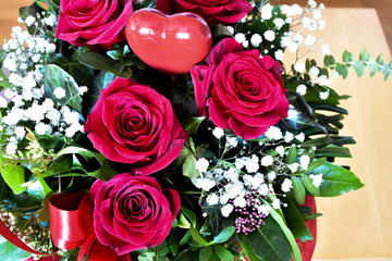 Bouquet with red roses and heart decoration