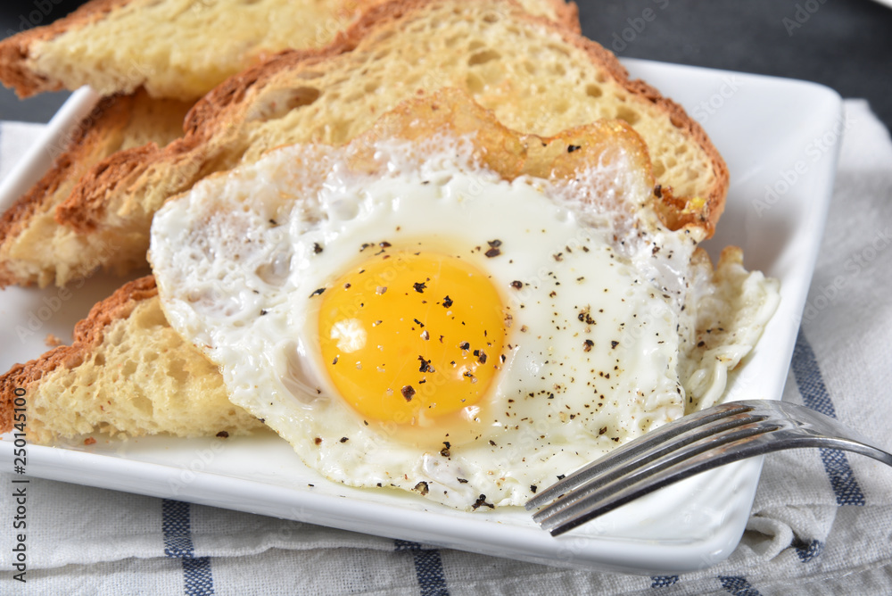 Wall mural fried egg on toast