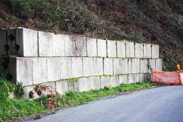 road works. signs, containment boulders for landslides and mountain roads.