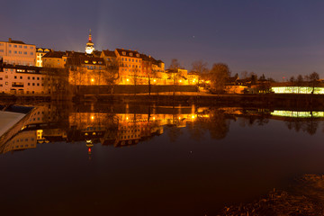 Fototapeta na wymiar Night winter royal medieval Town Pisek with the Castle above the river Otava, Czech Republic 