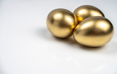 background, postcard, with three Golden eggs on white background for text input