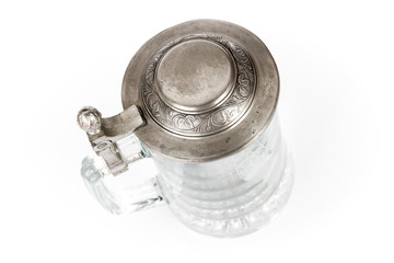Vintage beer glass with metallic cover on white background - photo