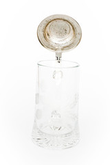 Vintage beer glass with metallic cover on white background - photo