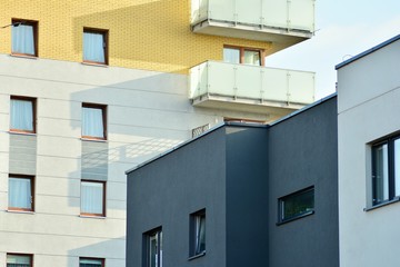 Modern white building with balcony on a blue sky