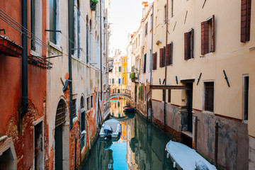 Fototapeta na wymiar Canal and Venetian old street in Italy