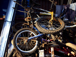 Broken bicycles at a junkyard