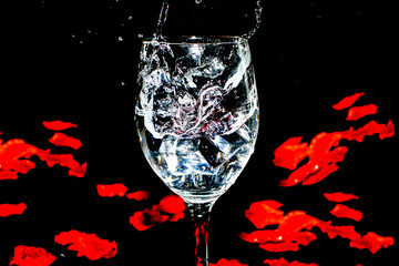 Splashing water with rose petals