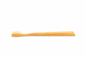Bamboo toothbrush on white background.