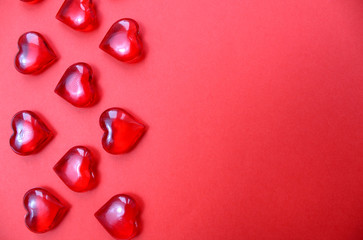 Texture red hearts on a red background