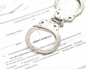 Arrest Warrant Court papers with Handcuffs