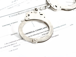 Criminal Complaint Court Papers with Handcuffs