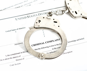 Criminal Complaint Court Papers with Handcuffs