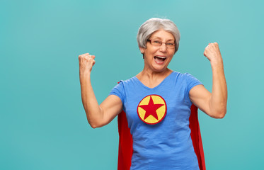 senior woman on teal background