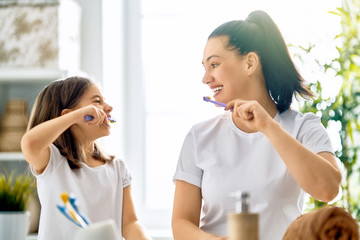 family are brushing teeth