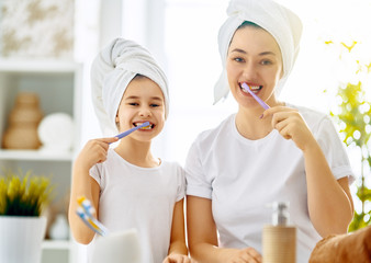 family are brushing teeth