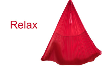 Fly yoga. Silhouette of a relaxing girl in a red hammock for aerial yoga on a white background. The girl is engaged in yoga. Copy space