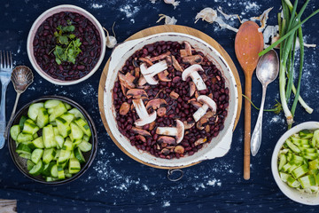 Cooked red beans with wine, mushrooms, herbs and spices. Vegetarian lunch, vegan dinner, healthy food. Top above view