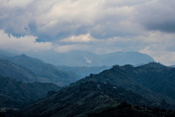 Obraz premium View of green mountains and clouds
