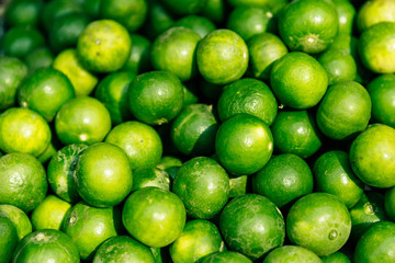 Ingredients Top View, Fresh lime Citrus, green limes background, Manaw is Thai call, top view at Fresh market in Thailand 