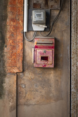 Old Thailand post box on the stucco wall.