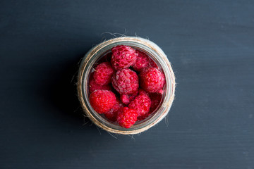 Healthy refreshment breakfast with yogurt, frozen raspberry and chia seeds. Selective focus. Shallow depth of field.