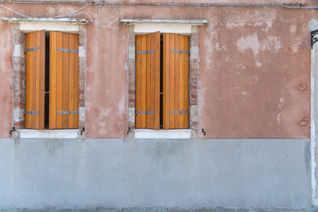 Fototapeta na wymiar Picturesque windows with shutters