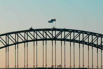 Silhouette of Sydney Harbour Bridge at sunset time.