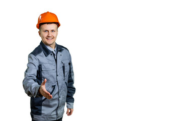 Senior engineer man, construction worker holds hands welcoming in a handshake pose, expressing the concept of trust and success, welcoming at work. Focus on the hands. isolated