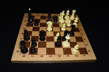 Chess board with black chessmen like a game concept