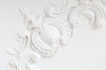 Beautiful ornate white decorative plaster moldings in studio