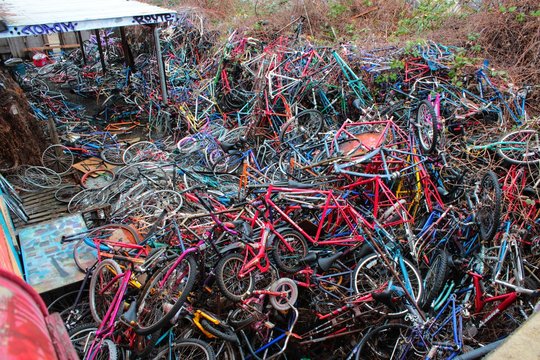 Old Bicycles Awaiting a New Life in Closed Down Bicycle Collective