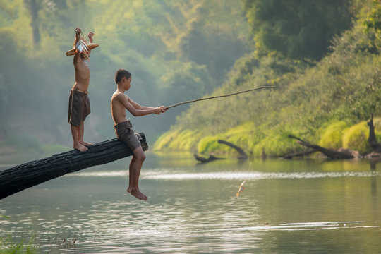 Children poverty living in countryside Vietnam are fishing at the river,Rural concept of Asia