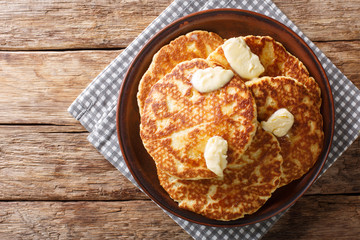 Gorditas de Azucar (Sweet Griddle Cakes) with butter close-up on a plate. horizontal top view