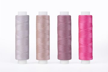 Set of sewing thread coils, miscellaneous colours, isolated on white