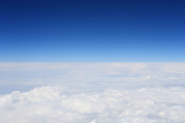 Fototapeta na wymiar Beautiful natural cloudscape. Blue sky and clouds airplane