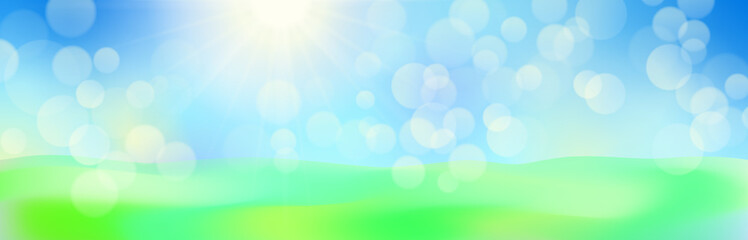 Obraz premium 輝く春の日差しと緑の草原の背景