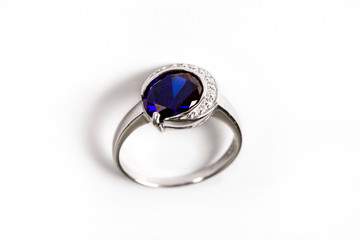 Luxury ring with blue sapphire isolated on white background