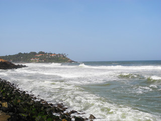 Fototapeta na wymiar Waves and rocks at coast of Arabian sea, Kerala, Trivandrum