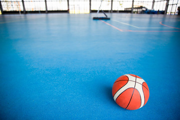 Basket ball on floor at gym