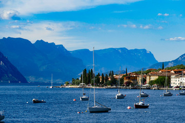 Fototapeta na wymiar Riva del Garda, Sailboats on Garda Lake, Veneto region, Brenzone, Italy.