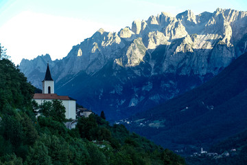 Fototapeta na wymiar Vallarasa, road SS46. Dolomiti mountains, Italy, Church