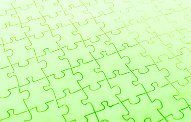 Assembled puzzle on a bright green background.